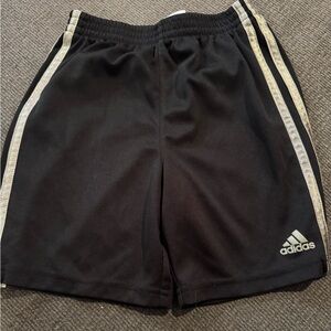 Black adidas shorts with three grey lines on each side